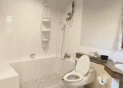 Modern bathroom with bathtub and toilet