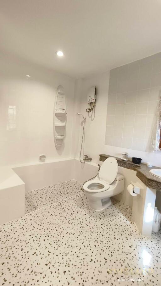 Modern bathroom with bathtub and toilet