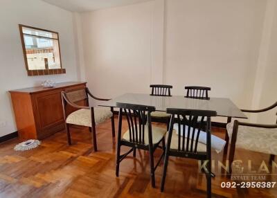 Dining room with wooden furniture and floor