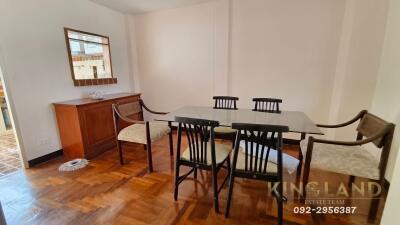 Dining room with wooden furniture and floor