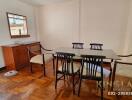 Dining room with wooden furniture and floor