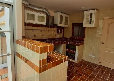 Small kitchen space with brick and tile design