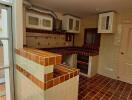 Small kitchen space with brick and tile design