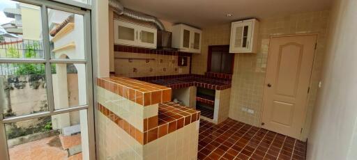 Small kitchen space with brick and tile design