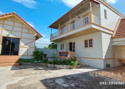 Exterior view of a residential house with a balcony