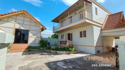 Exterior view of a residential house with a balcony