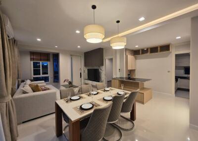 Modern open-concept living and dining area with kitchen