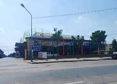 Exterior view of a building with signage and street