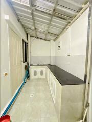 Simple kitchen with counter and storage cabinets