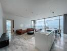 Spacious modern living room with open kitchen and city view