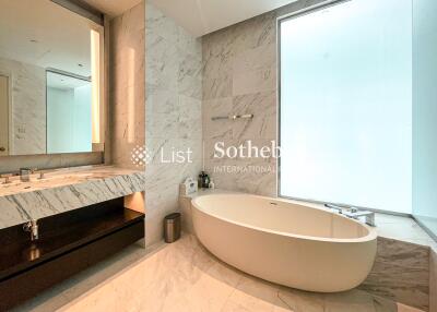 Luxurious bathroom with a marble finish and modern fixtures