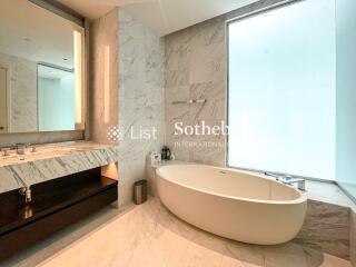 Luxurious bathroom with a marble finish and modern fixtures