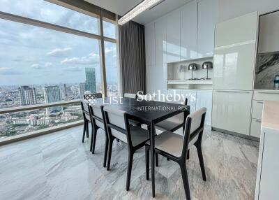 Modern dining area with large windows and city view