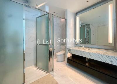 Modern bathroom with glass shower and marble sink