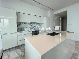 Modern kitchen with island and marble accents