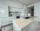 Modern kitchen with island and marble accents