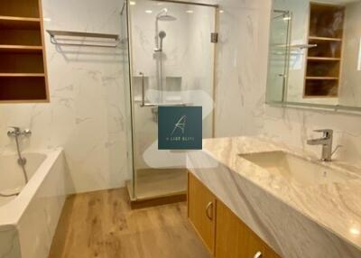 Modern bathroom with glass shower and marble counter