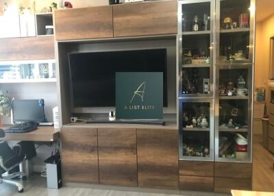 Modern living room with entertainment center and workspace