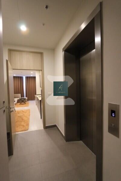 Elevator area with view into a furnished living space