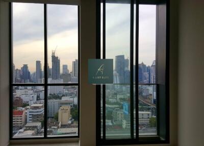 View of cityscape from tall building with multiple windows