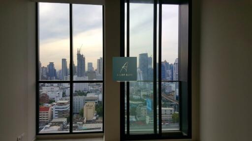 View of cityscape from tall building with multiple windows