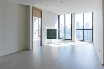 Spacious living area with large windows and city view