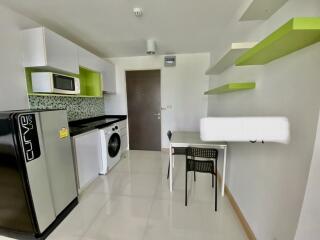 Modern kitchen and dining area with appliances