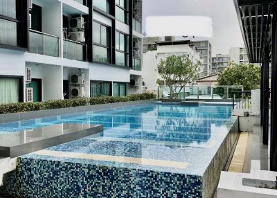 Modern apartment building with a rooftop swimming pool