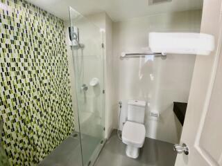 Modern bathroom with glass shower and toilet