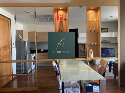 Modern kitchen with dining area and built-in shelves