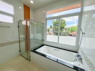 Modern bathroom with bathtub and shower