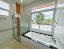 Modern bathroom with bathtub and shower