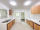 Modern kitchen with wooden cabinets and dual sinks