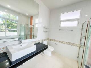 Modern bathroom with large mirror and glass shower