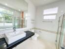 Modern bathroom with large mirror and glass shower