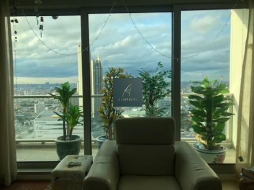 Living room with a scenic view and indoor plants