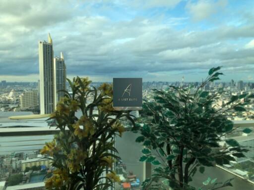 view from living room window overlooking city skyline