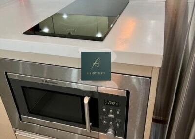 Modern kitchen with built-in microwave and stovetop