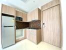 Modern kitchen with wooden cabinetry and appliances