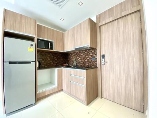 Modern kitchen with wooden cabinetry and appliances