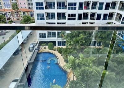 View from the balcony overlooking a swimming pool