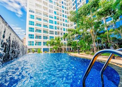 Apartment building with outdoor pool and waterfall