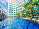 Apartment building with outdoor pool and waterfall