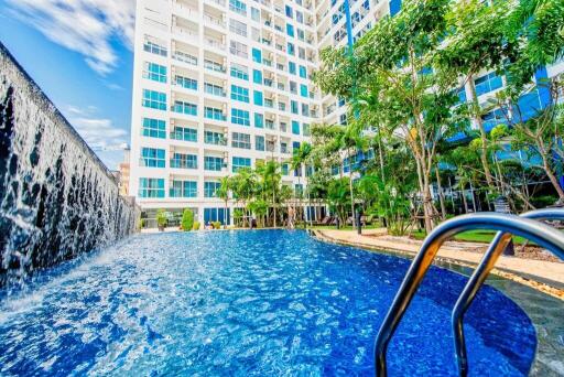 Apartment building with outdoor pool and waterfall