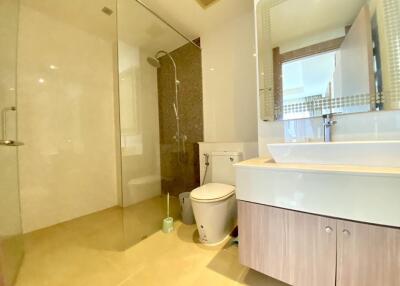 Modern bathroom with glass shower enclosure and vanity