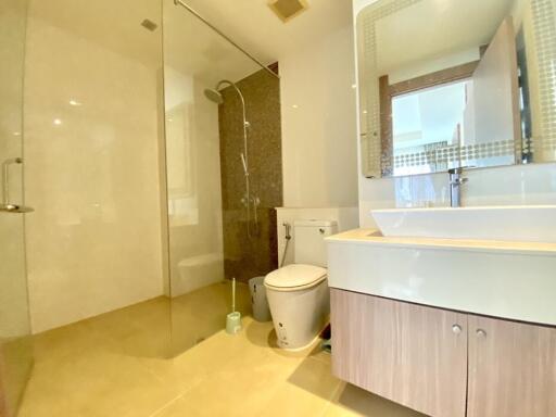 Modern bathroom with glass shower enclosure and vanity