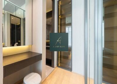 Modern bedroom with vanity and mirrored closets