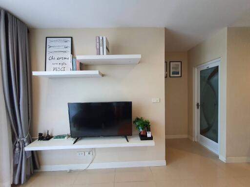 Modern living room with TV and shelves