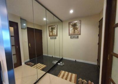 Modern entryway with mirrored wardrobe