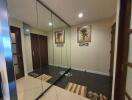 Modern entryway with mirrored wardrobe